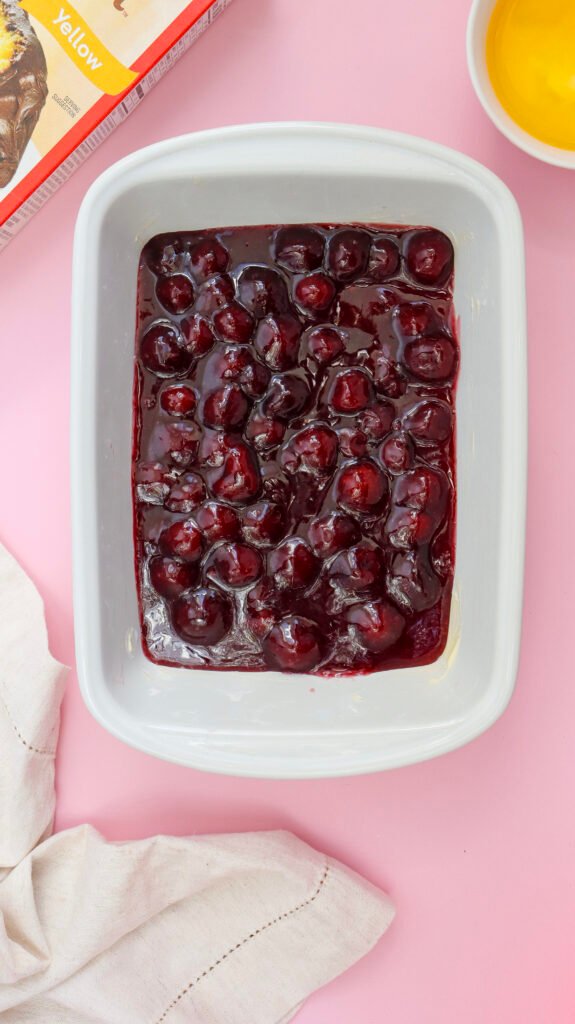spreading the pie on the baking pan