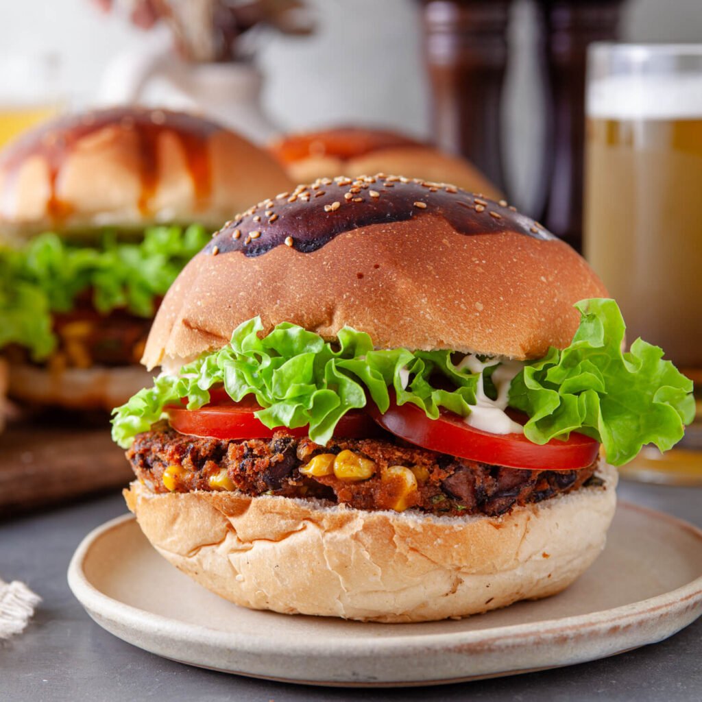 a fully assembled black bean veggie burger on a plate