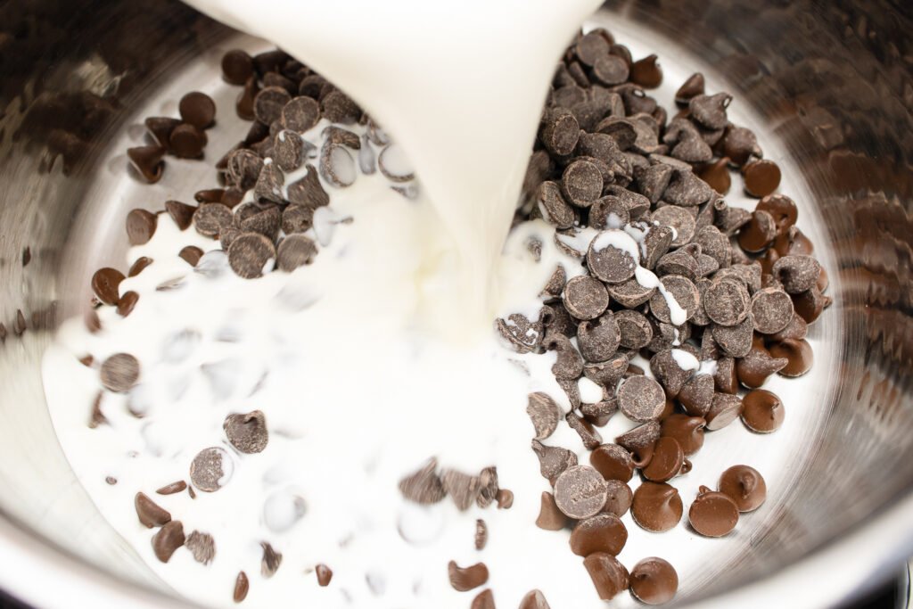 combining heavy cream with chocolate chips over medium-low heat to make chocolate mousse