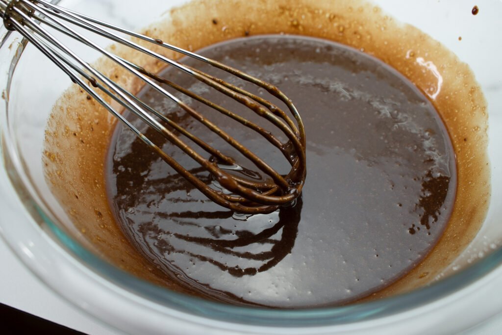 add orange zest to the egg and melted chocolate mixture to make chocolate mousse