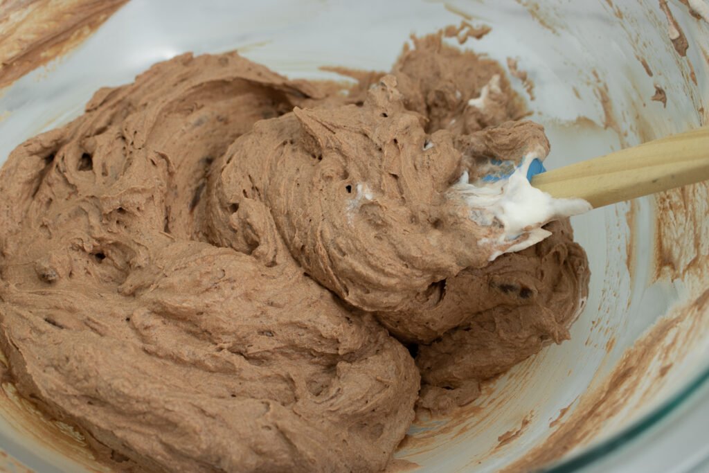 fold the chilled chocolate into the whipped cream to make chocolate mousse
