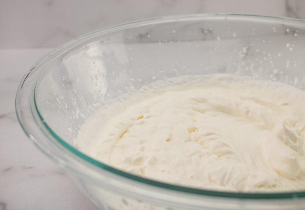 whip the remaining heavy cream until stiff peaks form