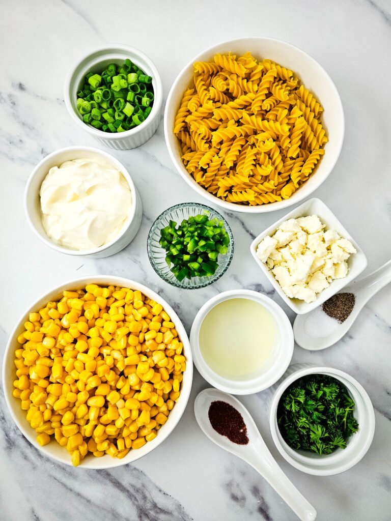 Overhead view of ingredients for Mexican street corn pasta salad recipe