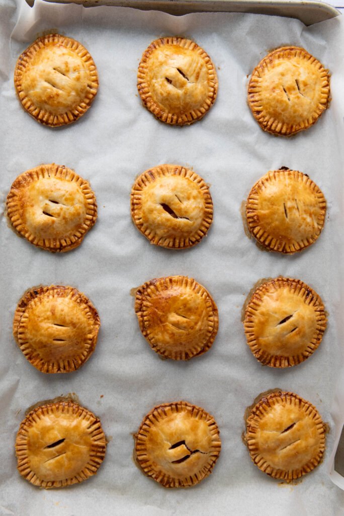 Freshly baked apple hand pies with golden brown crusts