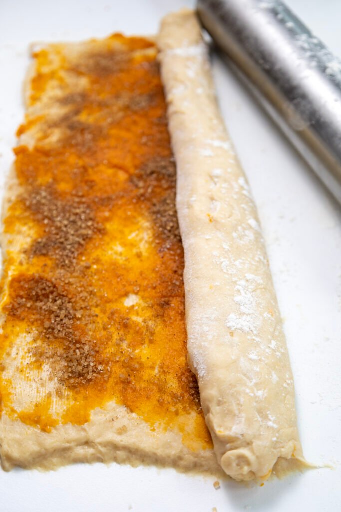 Dough rolled up with pumpkin and cinnamon sugar filling
