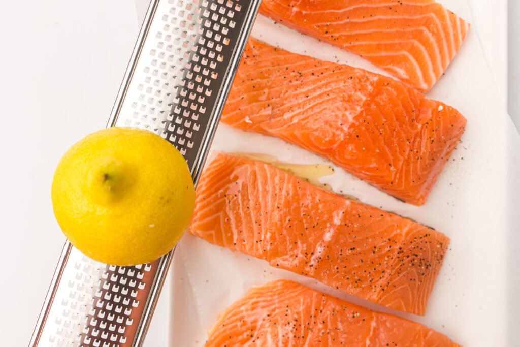 zest from the fresh lemon over the salmon fillets