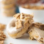 Close-up of Cinnamon Toast Crunch donuts topped with maple glaze and crushed cereal pieces