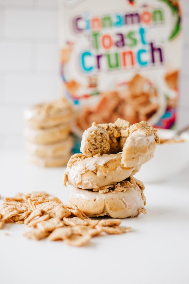 Stack of Cinnamon Toast Crunch Donuts topped with glaze and crushed cereal